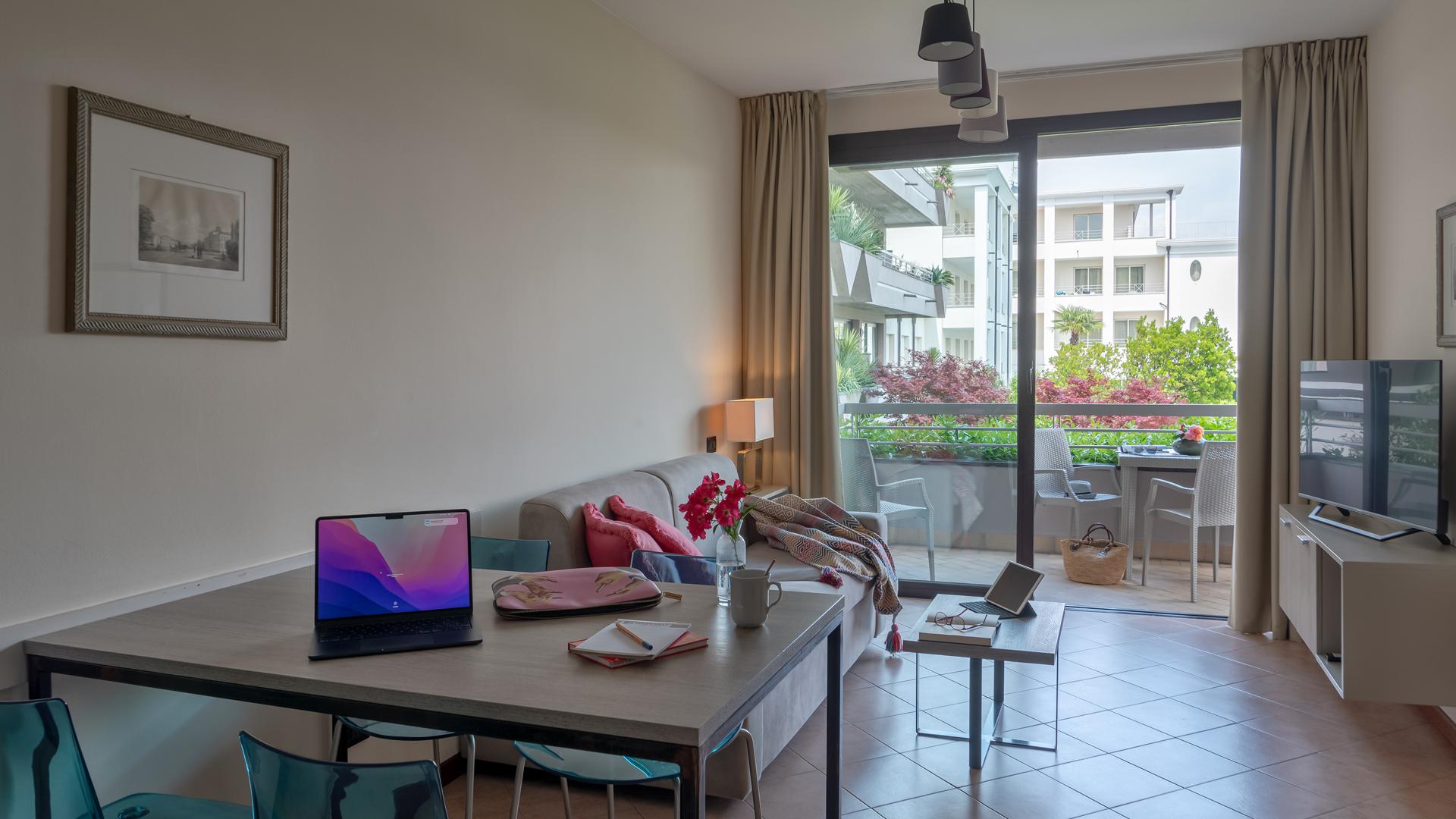 Bright room with balcony and city view.